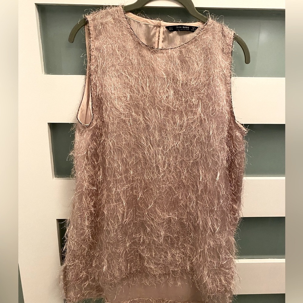 Fun, flirty, fringe, soft pink sleeveless top